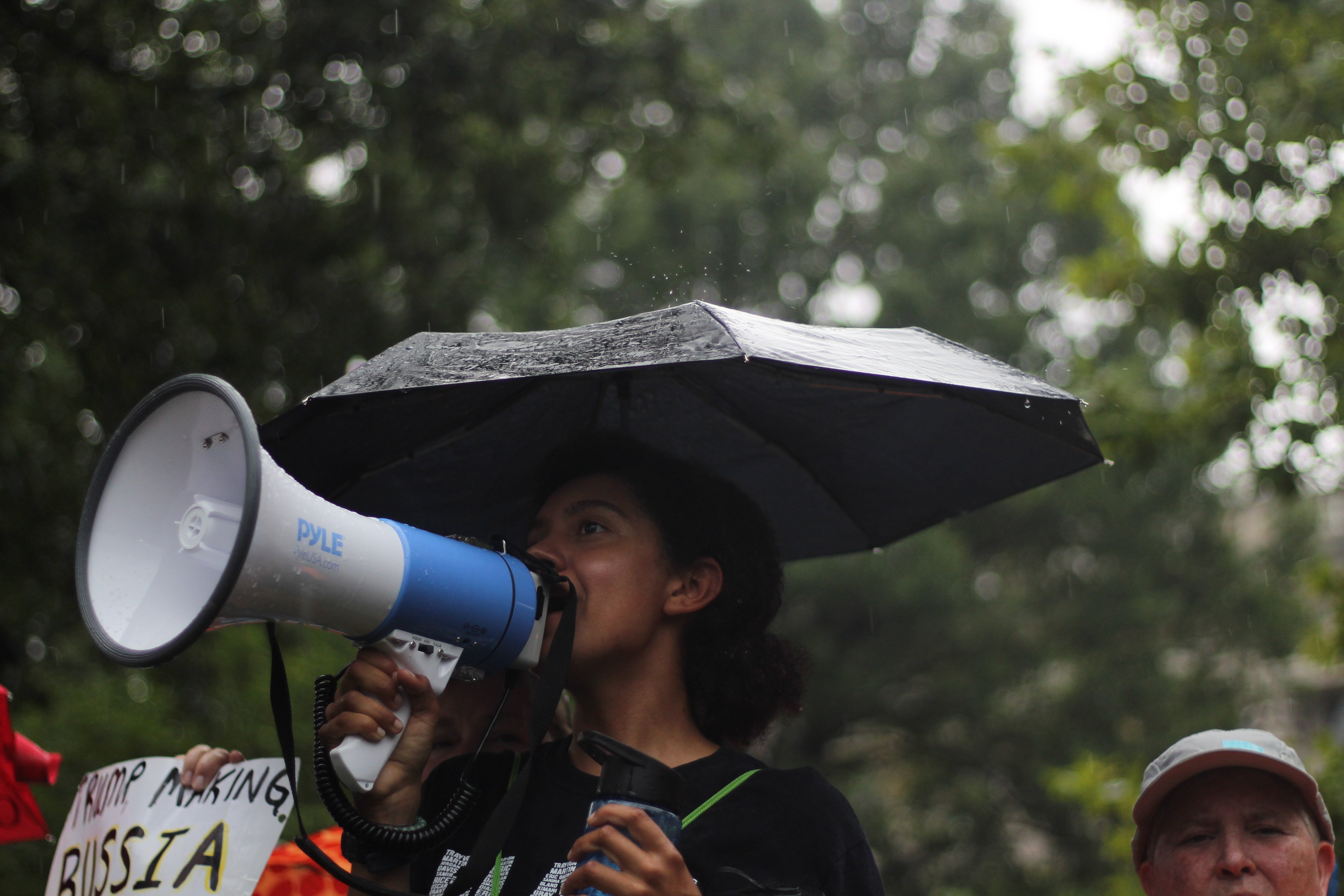 woman-with-umbrella-and-megaphone-image